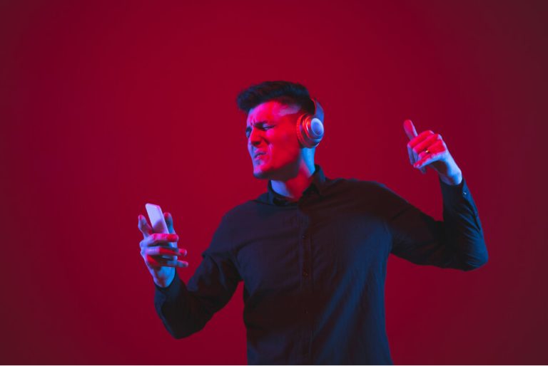 delighted-listen-music-caucasian-young-man-s-portrait-isolated-red-wall-neon-light-beautiful-male-model-concept-human-emotions-facial-expression-youth-culture 1 (1)