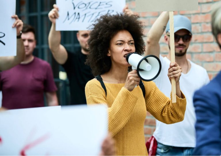 displeased-black-woman-participating-anti-racism-demonstrations-shouting-through-megaphone 1 (1)